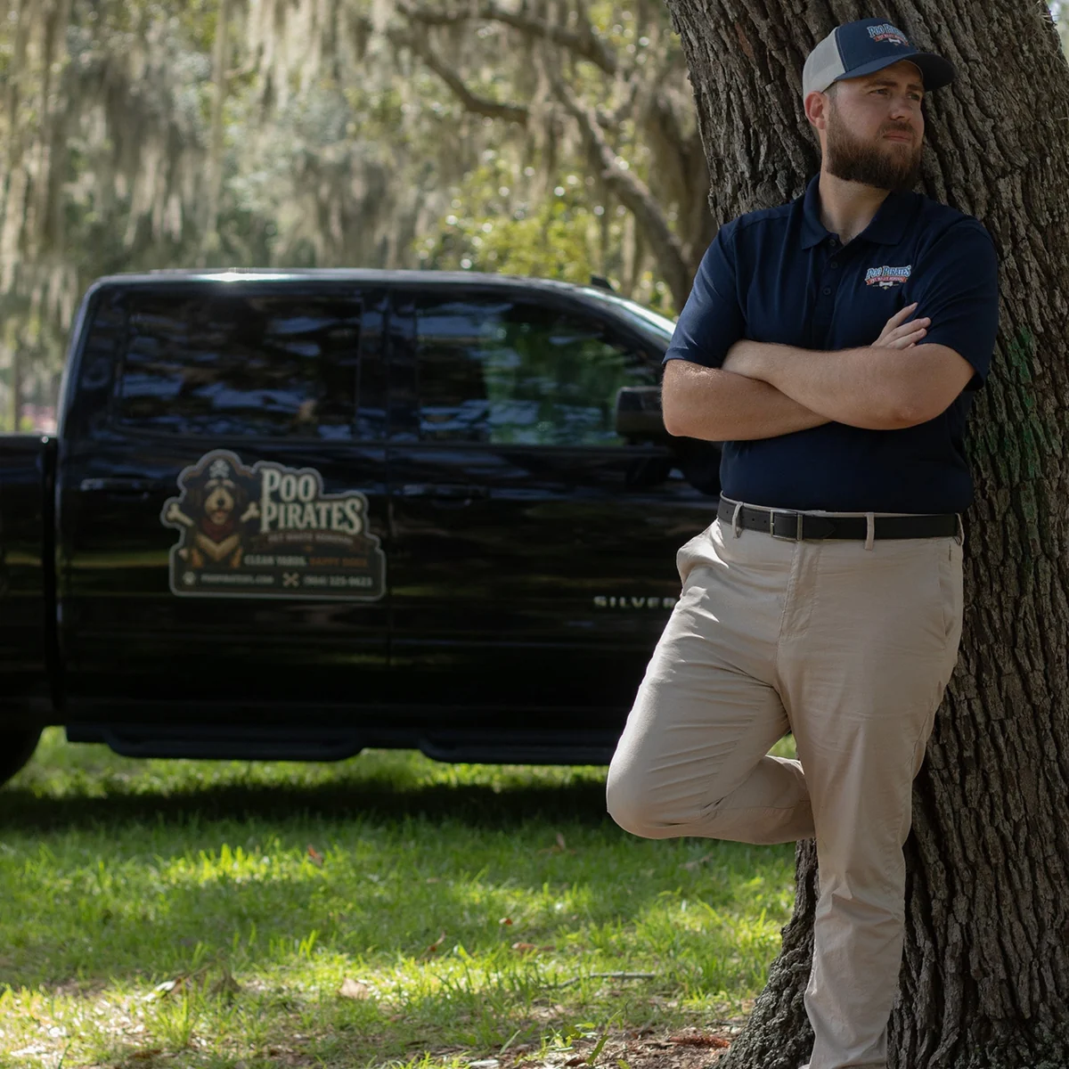 Poo Pirates owner with branded service truck in St. Augustine, Florida